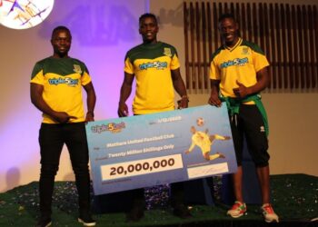 Mathare United's new signing David 'Cheche' Ochieng (centre) and his team-mates during the unveiling of a Sh20m sponsorship deal between the club and betting firm Triple5Bet at a Nairobi hotel on Tuesday. Photo/Apopo Mujema